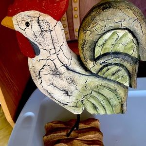 Wooden chicken on a wooden platform